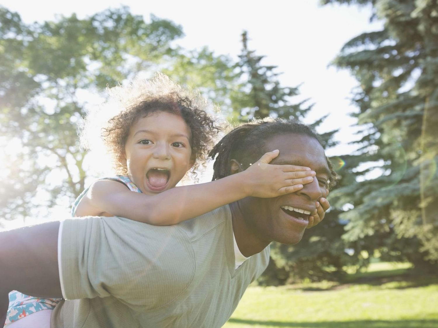 A father and a daughter joyfully playing together at La Galerie Hotel