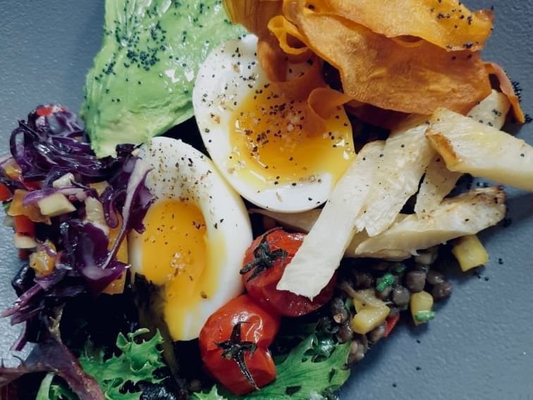 A salad with half-boiled eggs served at The Originals Hotels