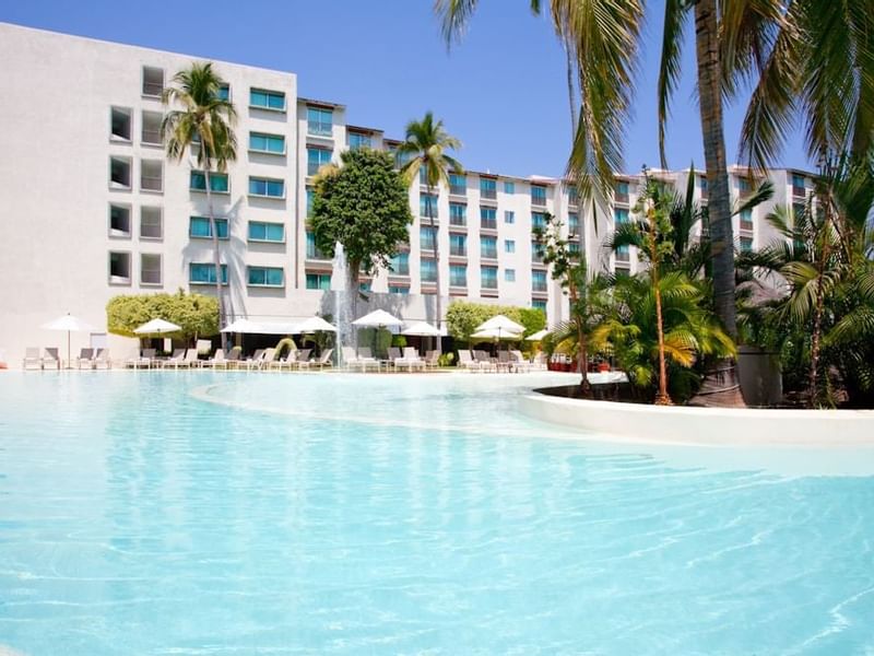 Large swimming pool & the hotel view at Gamma Hotels