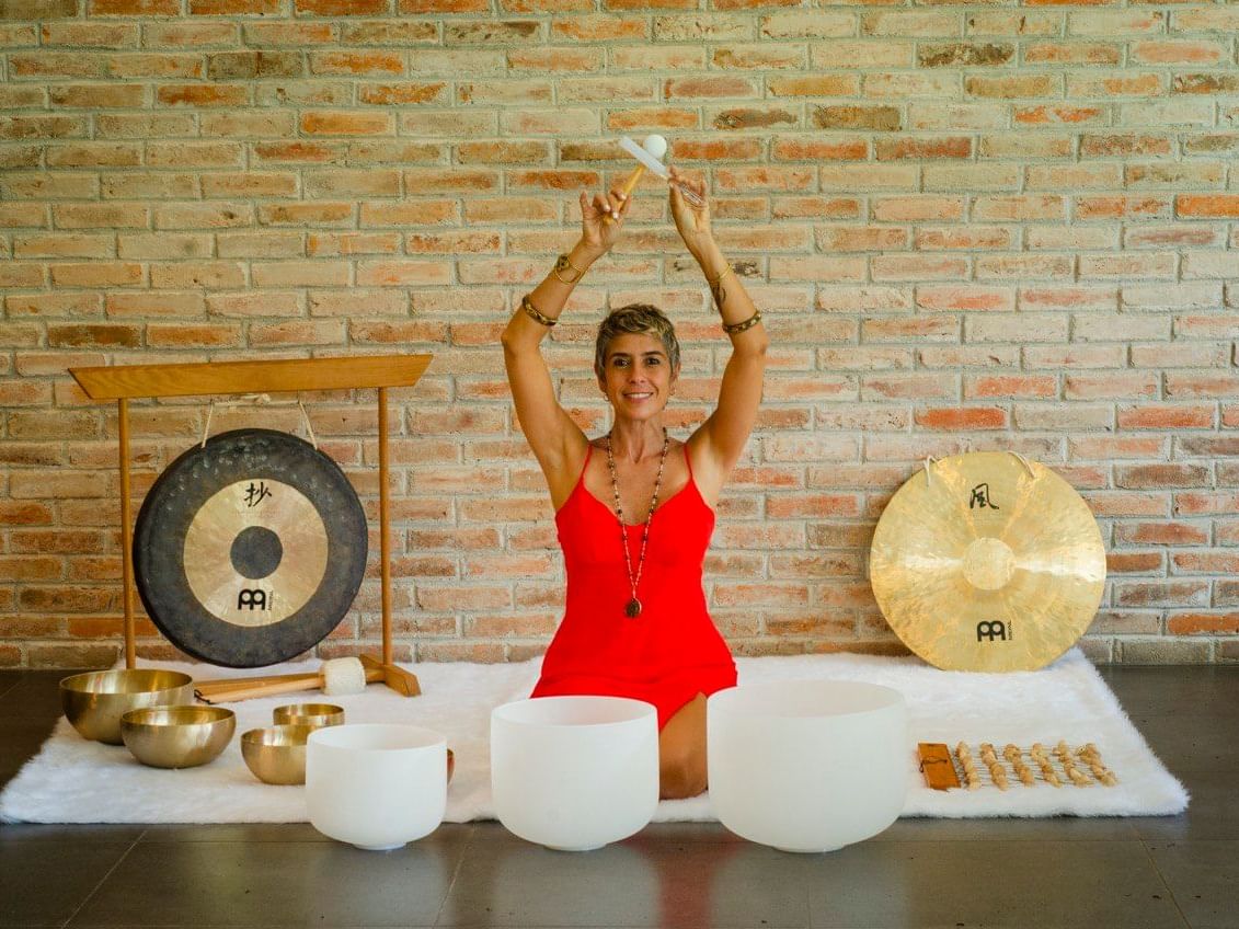 A Woman doing meditation exercises at Cala Luna Boutique Hotel