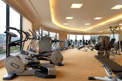 Well-equipped Fitness Center with bicycles & treadmills at One World Hotel