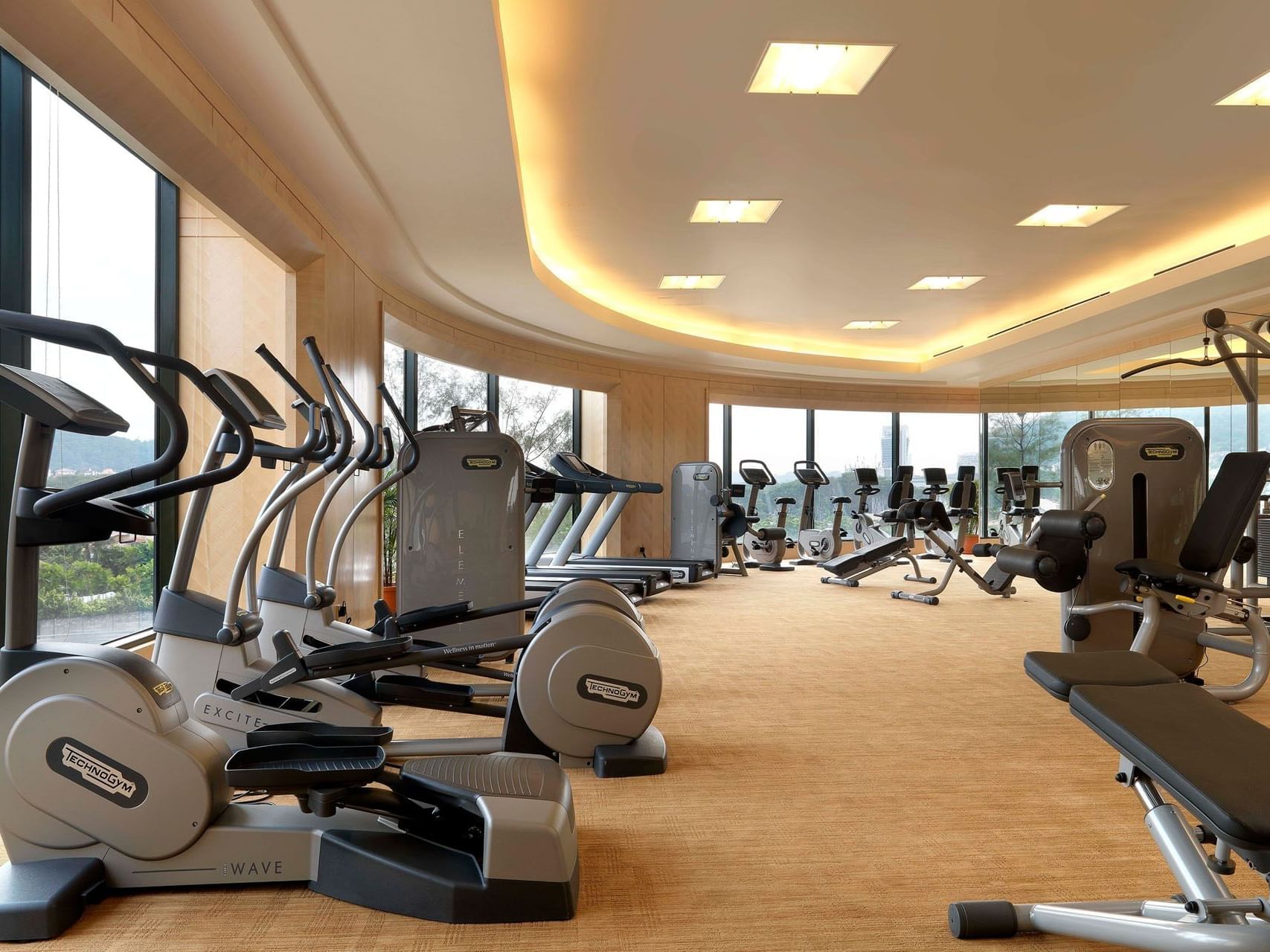 Well-equipped Fitness Center with bicycles & treadmills at One World Hotel