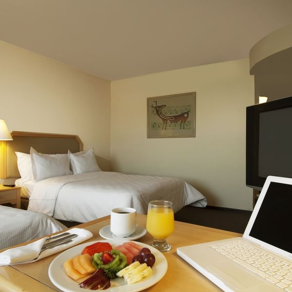 Fruit plate served with drinks in Superior Room at Fiesta Inn