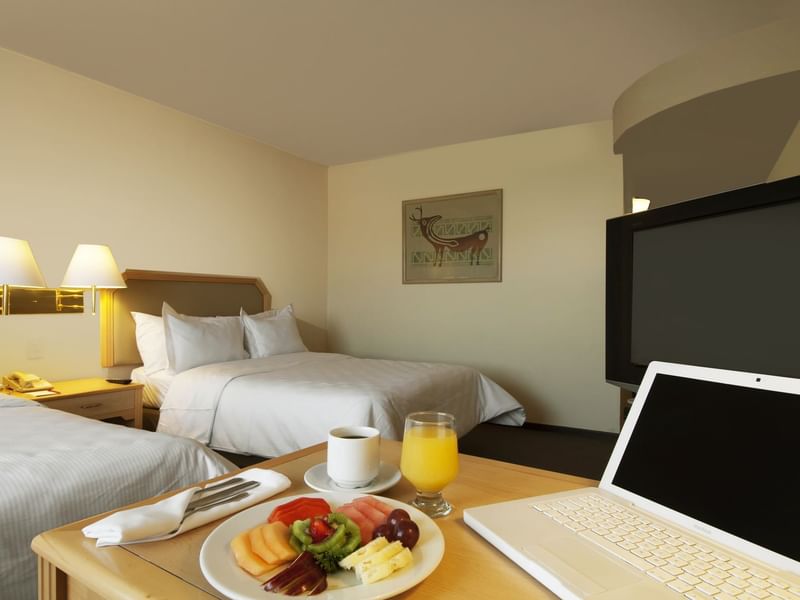 Fruit plate served with drinks in Superior Room at Fiesta Inn