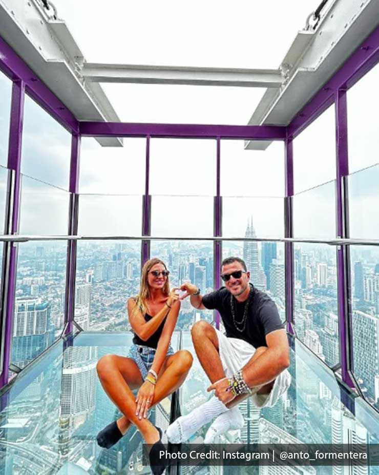 Cool couple posing on the Sky Deck of Menara Kuala Lumpur Tower, a tourist attraction near Imperial Lexis KL