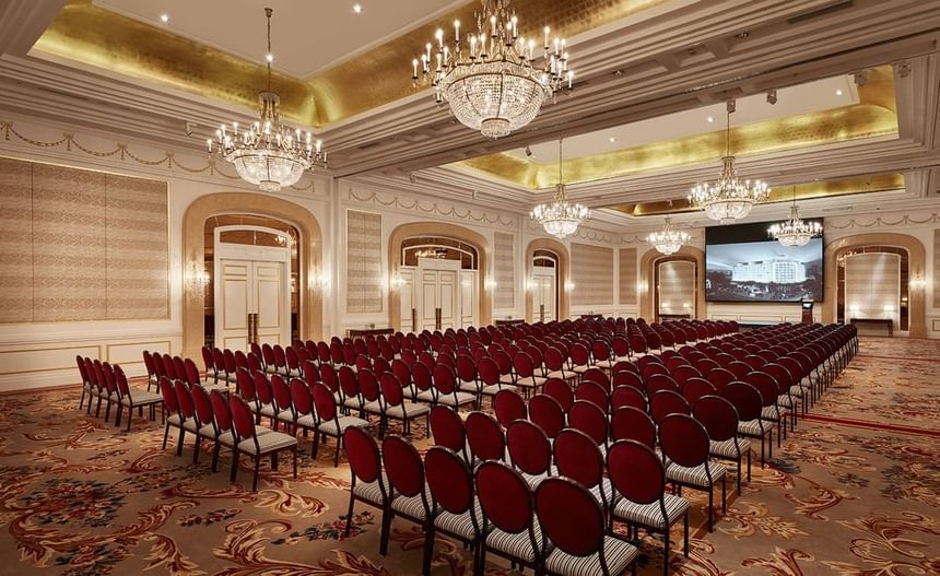 Chair arrangement in a Ballroom with an illuminated ceiling and carpeted floors at Park Hyatt Saigon