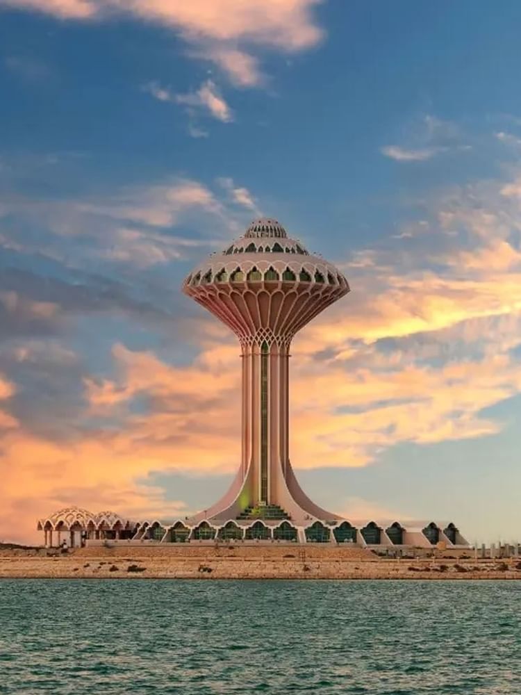 Al Khobar with colorful skyscrapers by a calm waterfront near Warwick Hotels & Resort
