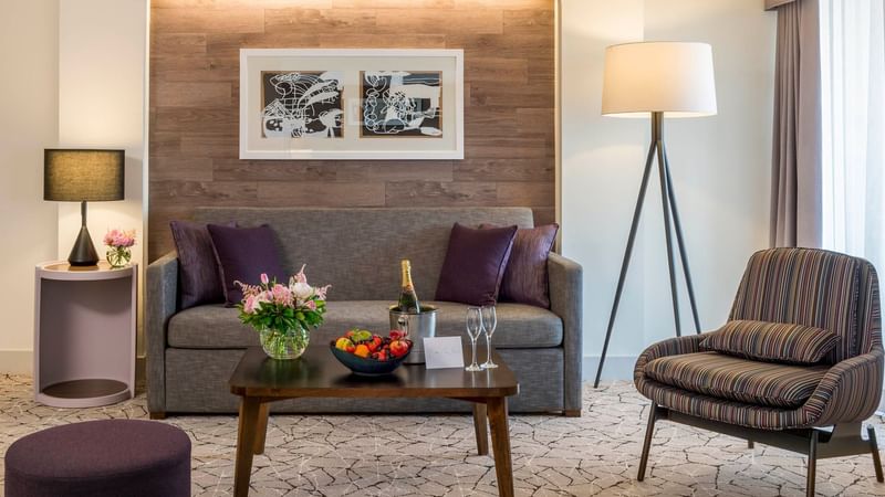 Living area with wall art and couches in Executive Suite at Warwick Denver