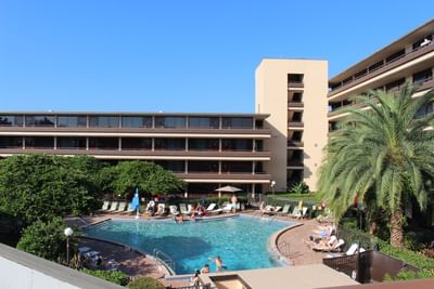 Exterior view of the hotel and pool at Rosen Inn at Pointe Orlando