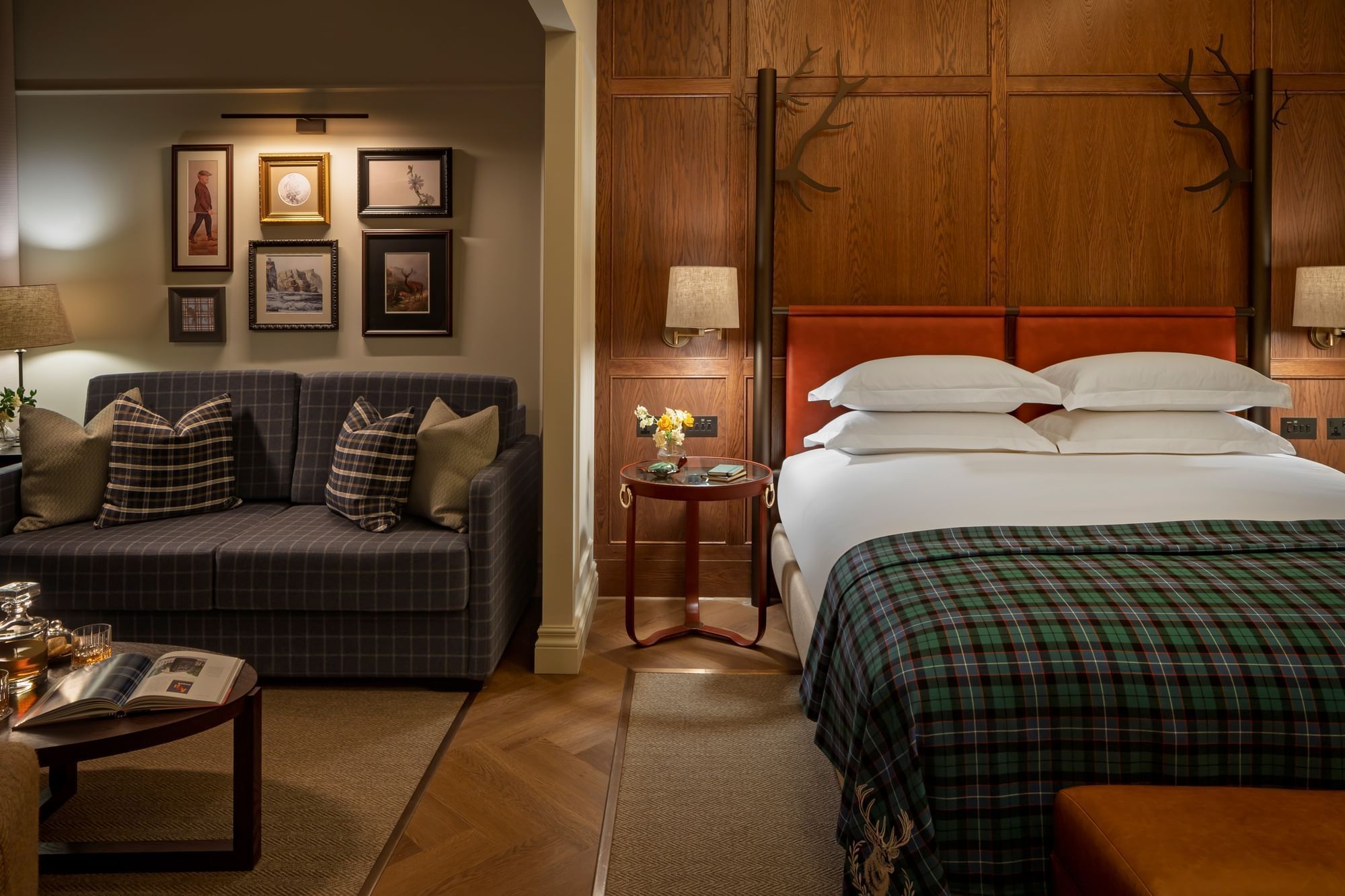 Bed Suite With Garden Terrace, featuring a plaid throw on the bed and a gray sofa with plaid pillows at Seaton House