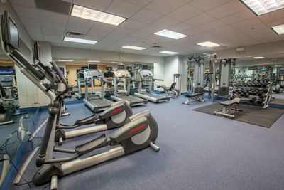 Interior of the fully-equipped fitness center at Kinzie Hotel