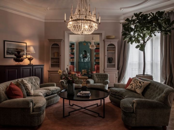 Interior of a living room featuring comfortable couches in Le Salon Room at The Sparrow Hotel