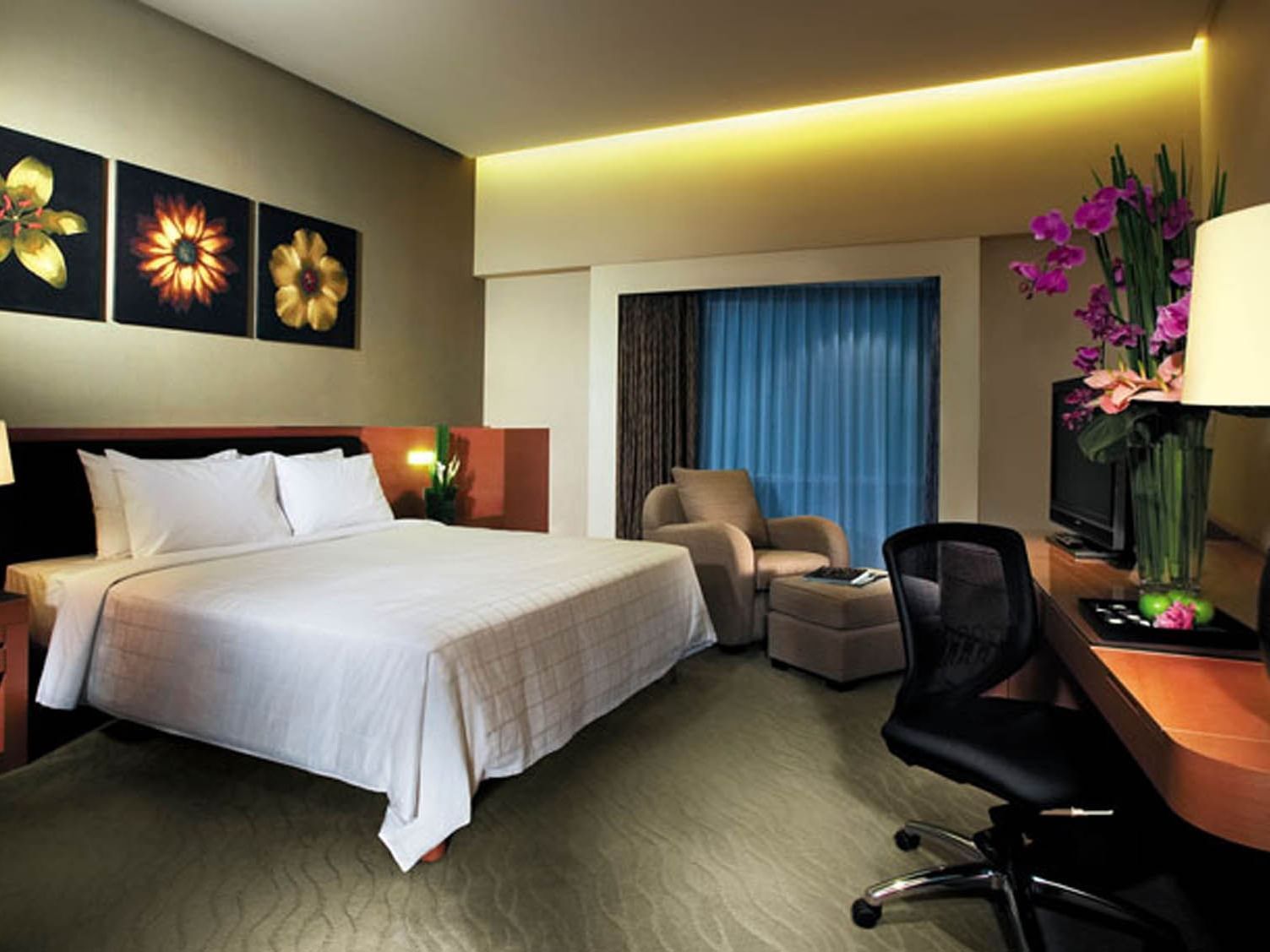 The Deluxe room with sofa at Gardens Hotel and Residences