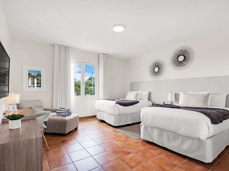 Double beds by the window in Two Bedroom Ocean View at Las Casitas Village