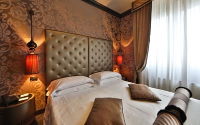 Close-up of king bed view in Suite at Hotel Mozart Milan