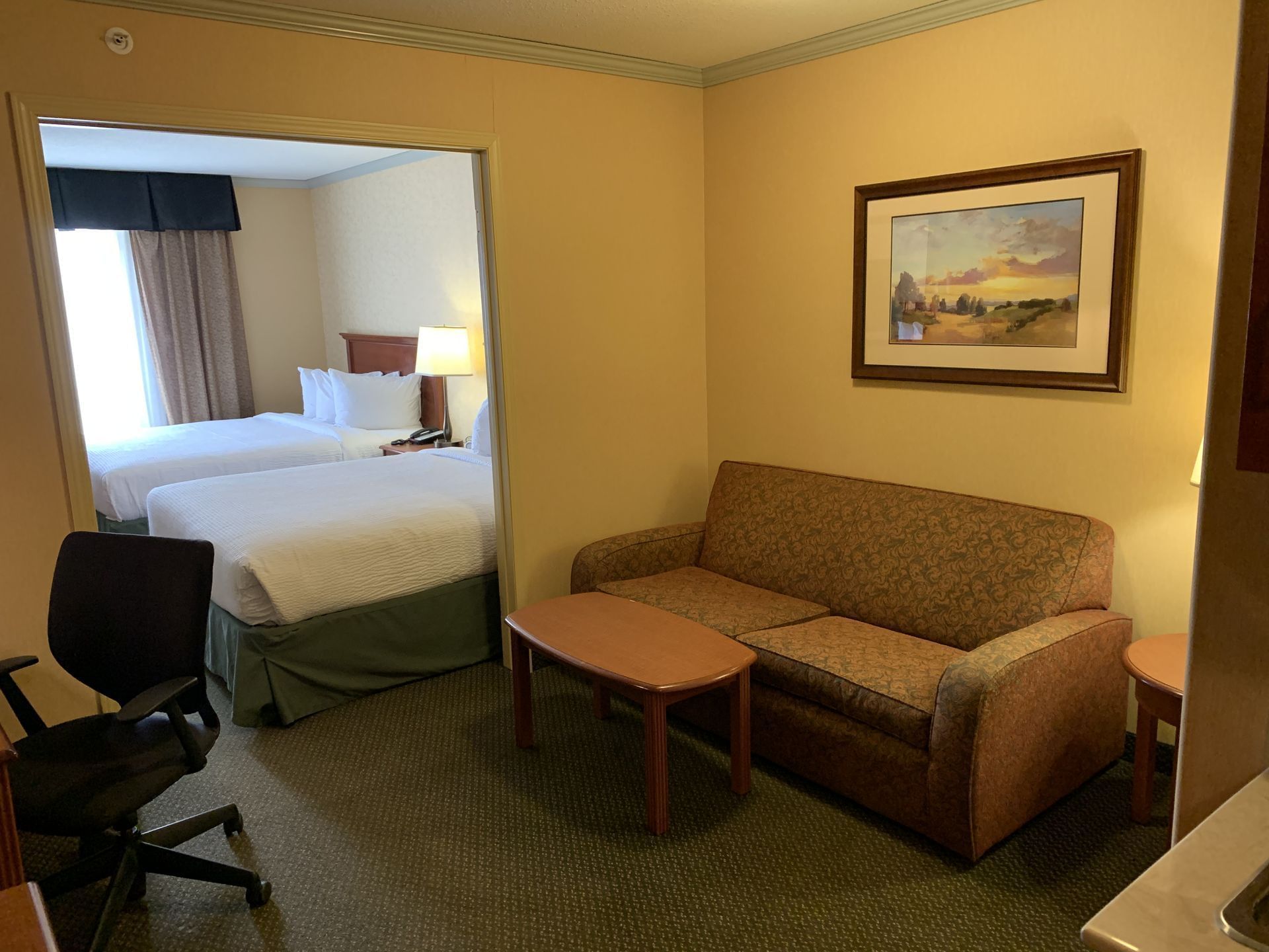 Lounge area in Business Suite Two Queens at Merit Hotel & Suites, Fort McMurray