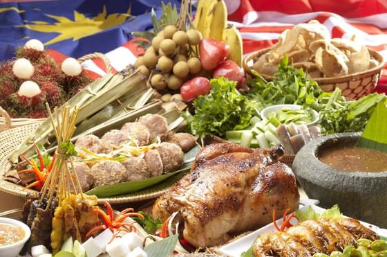 Assorted festive dishes with roasted poultry on a table adorned at Federal Hotels International
