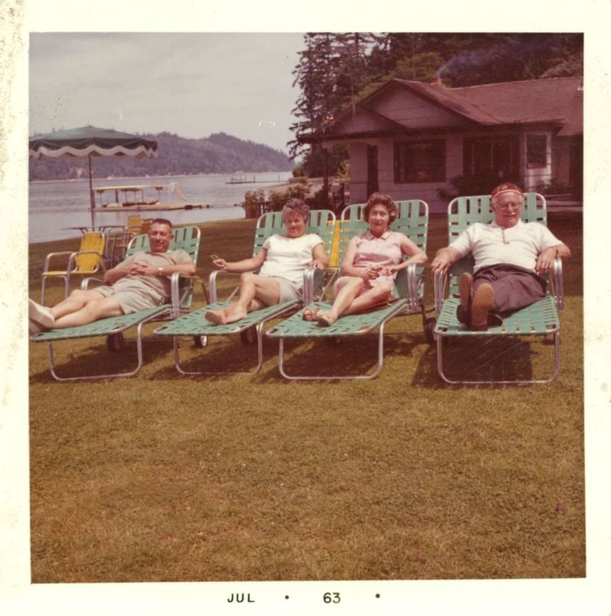 Vintage image of family lounging by the lake at Alderbrook Resort & Spa