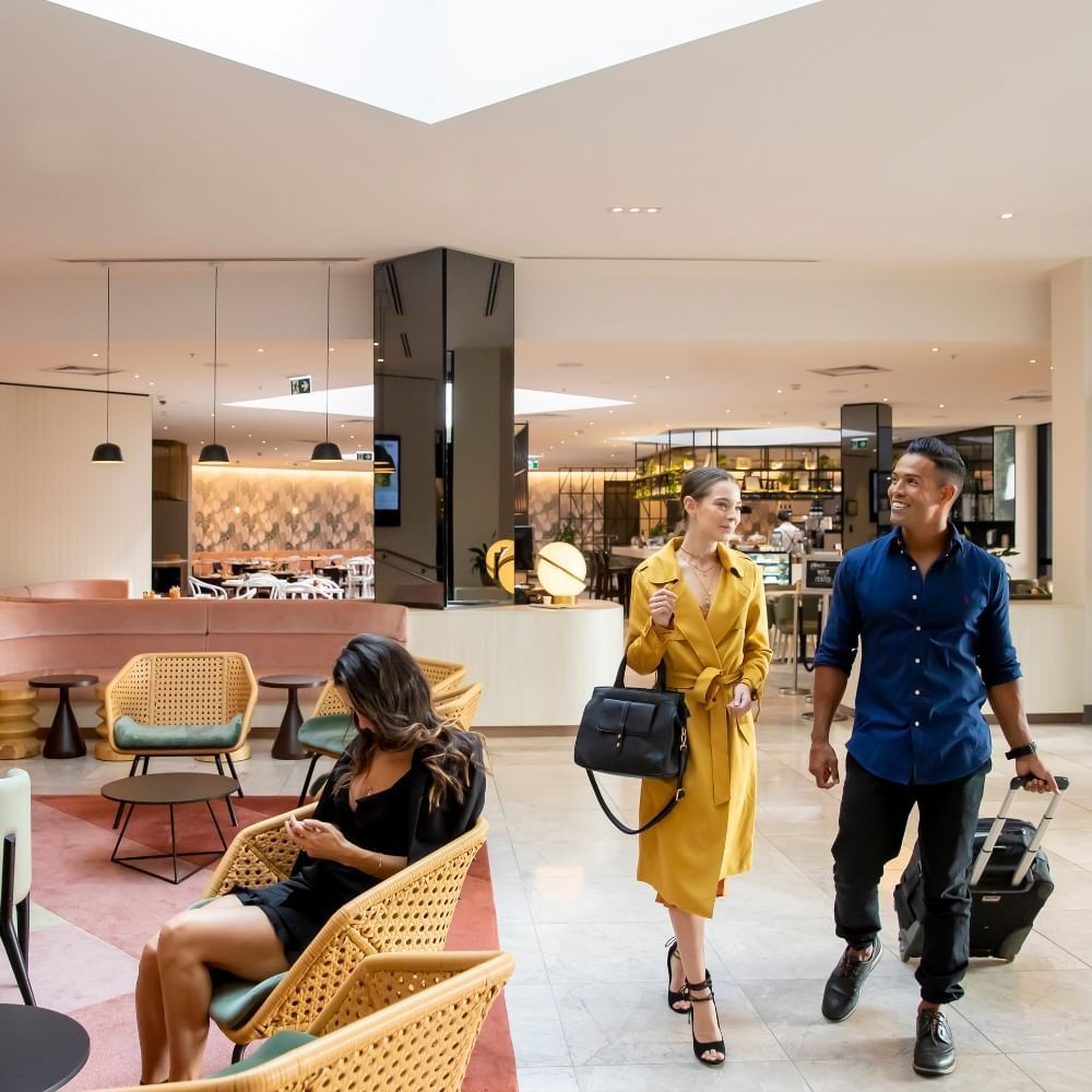 Couple walking at lobby | Novotel Sydney International Airport 