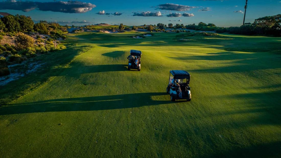 Golf Buggies driving on Central Coast Golf Course near Pullman Magenta Shores