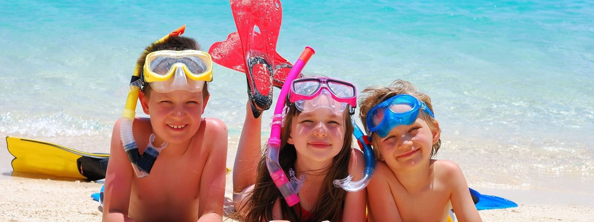 Kids posing in snorkeling fits at Daydream Island Resort