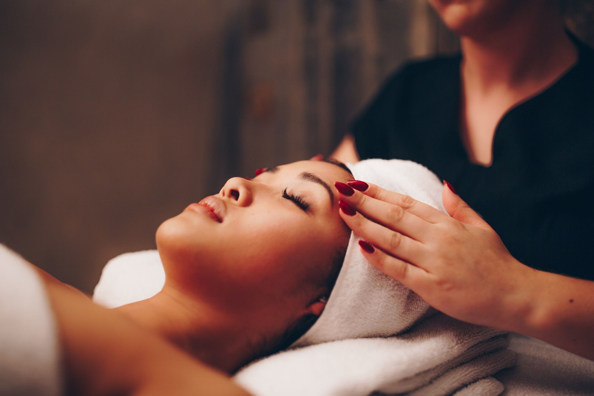 Close-up of a lady having spa treatments at The Londoner Hotel