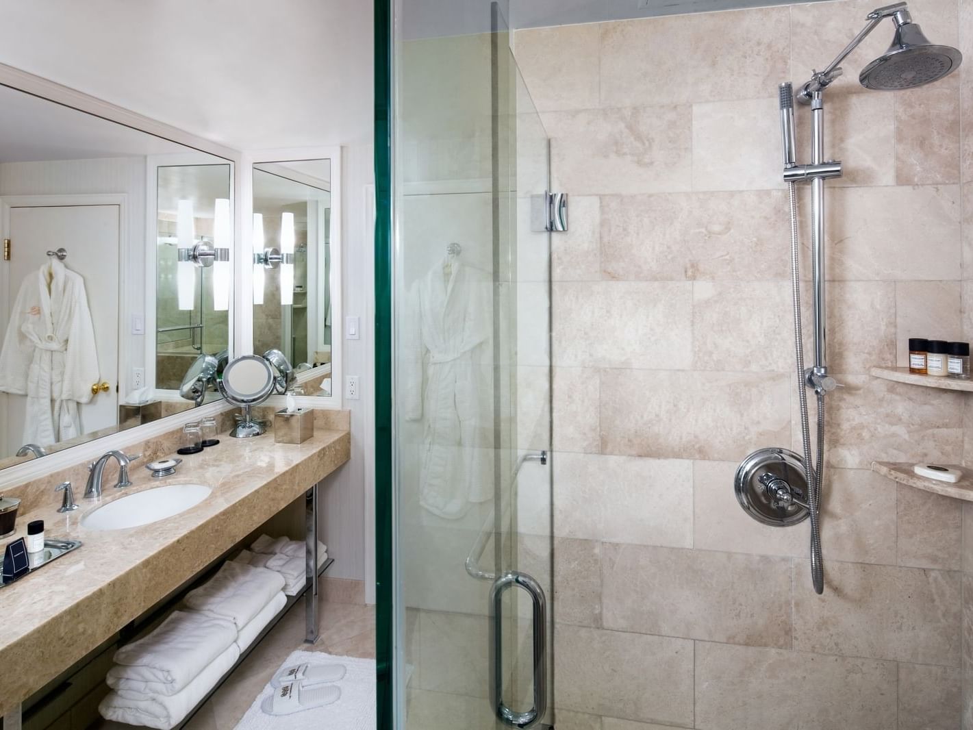 shower and vanity in hotel bathroom