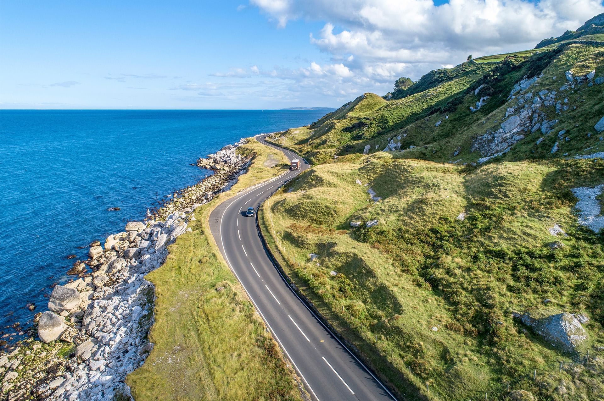 Aerial view of Causeway Coastal Route near Dunluce Lodge, showcasing things to do in Portrush