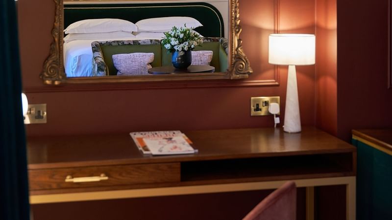 Wooden work desk & lamp in Deluxe Room at The Capital Hotel London