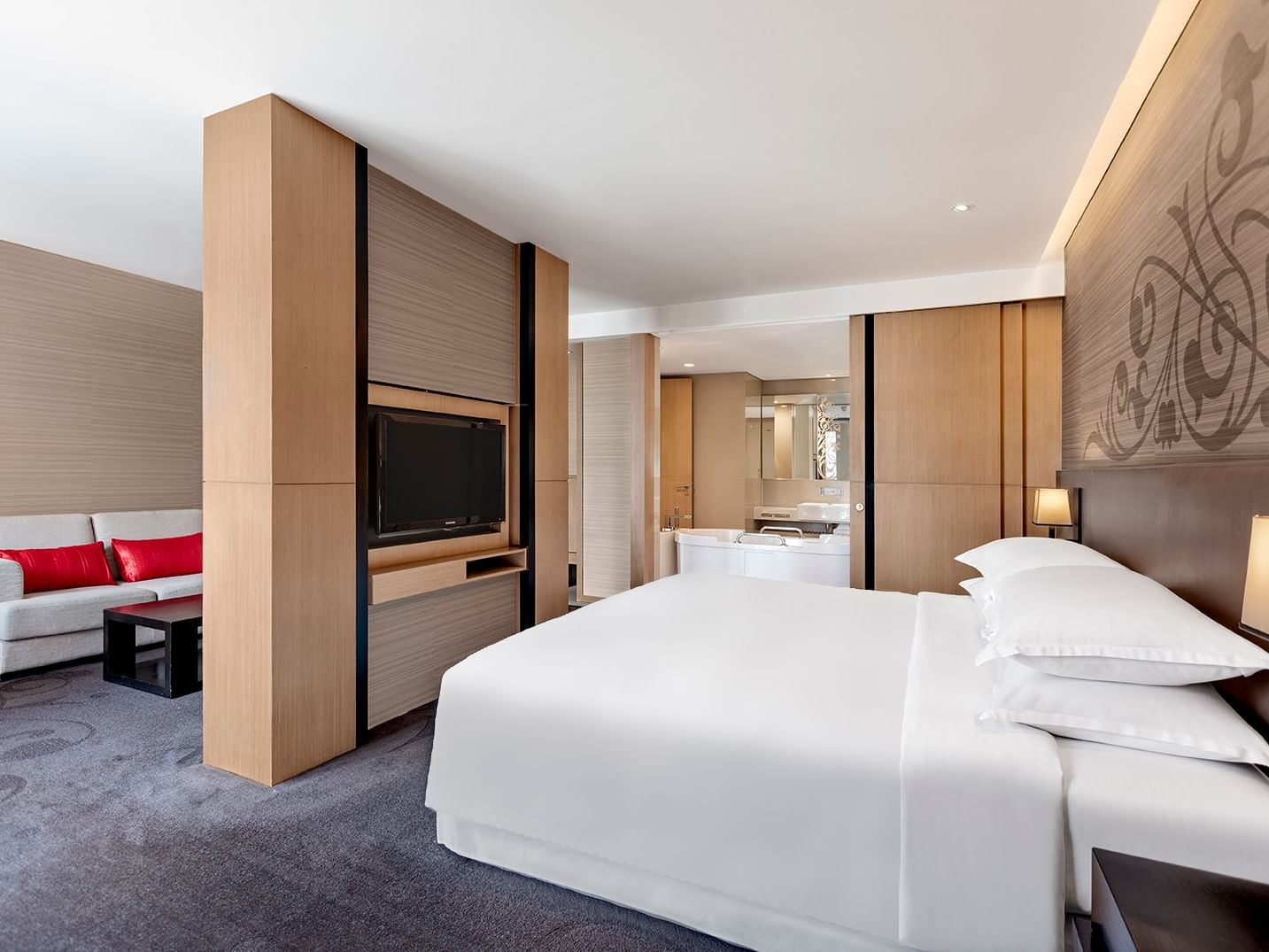 Studio Suite at Paradox Bangkok with lounge area & bathroom by the bedroom, highlighting comfy Sukhumvit accommodation hotel