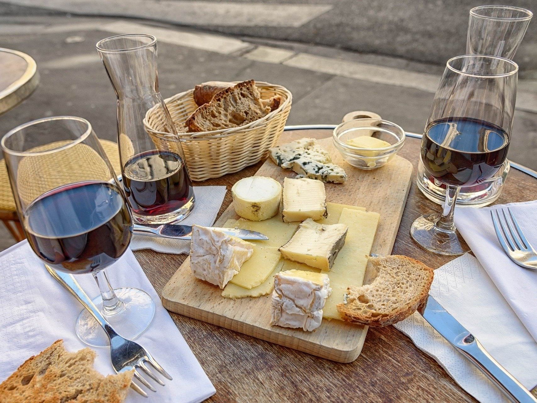Some cheese wine & bread on a table at NOI Blend Colchagua