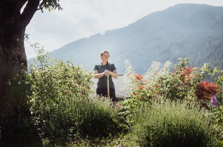 Female gardener in flower fields at Imlauer Schloss Hotel