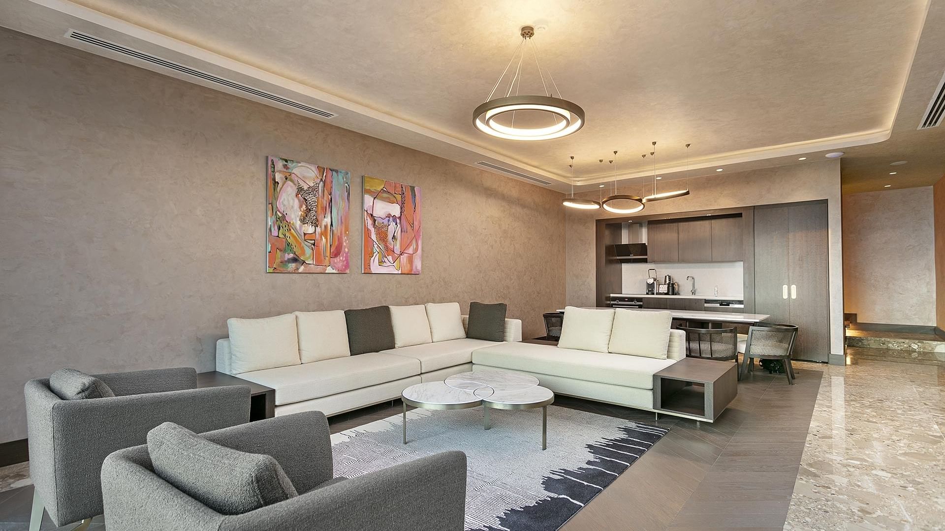 Kitchenette and living area of Cullinan Villa with wall art at Cullinan Belek