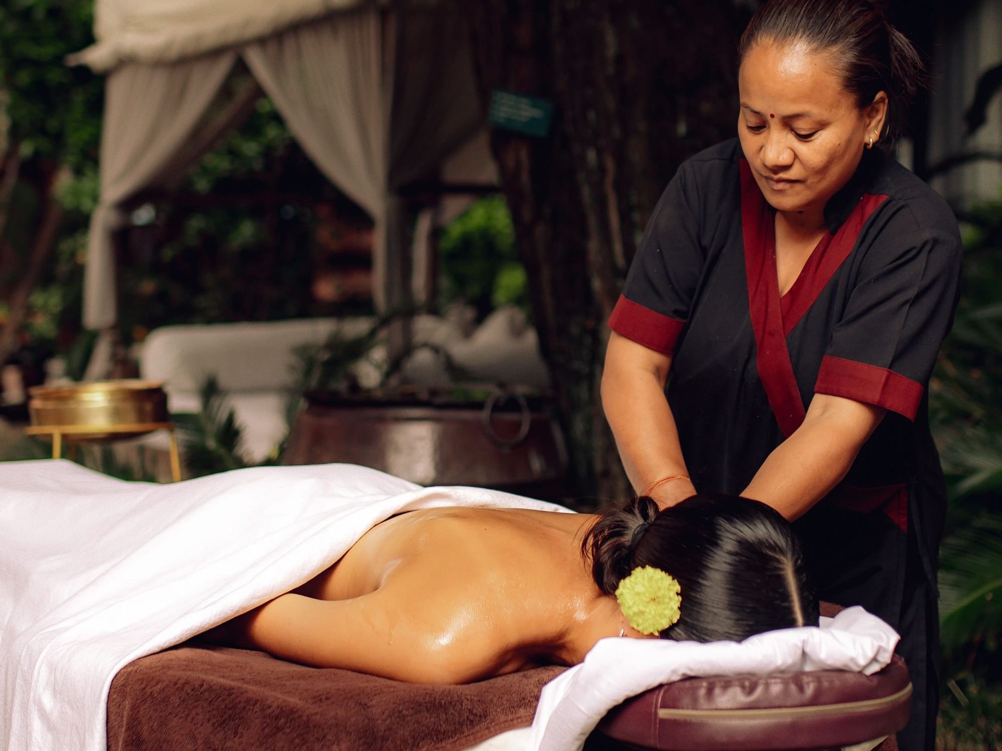 Masseur massaging a lady featuring, Pancha Kosha Signature Therapies at Dwarika's Hotel Kathmandu