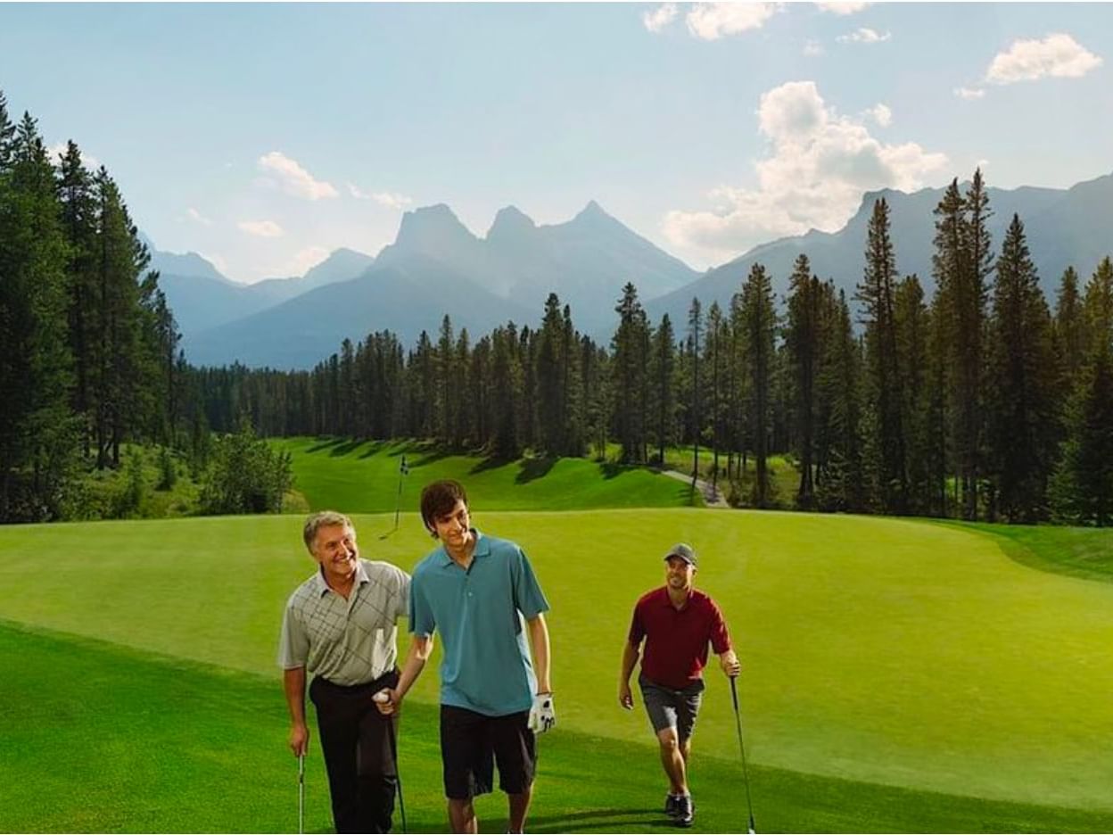 Three men playing golf at Silvertip near Falcon Crest Lodge