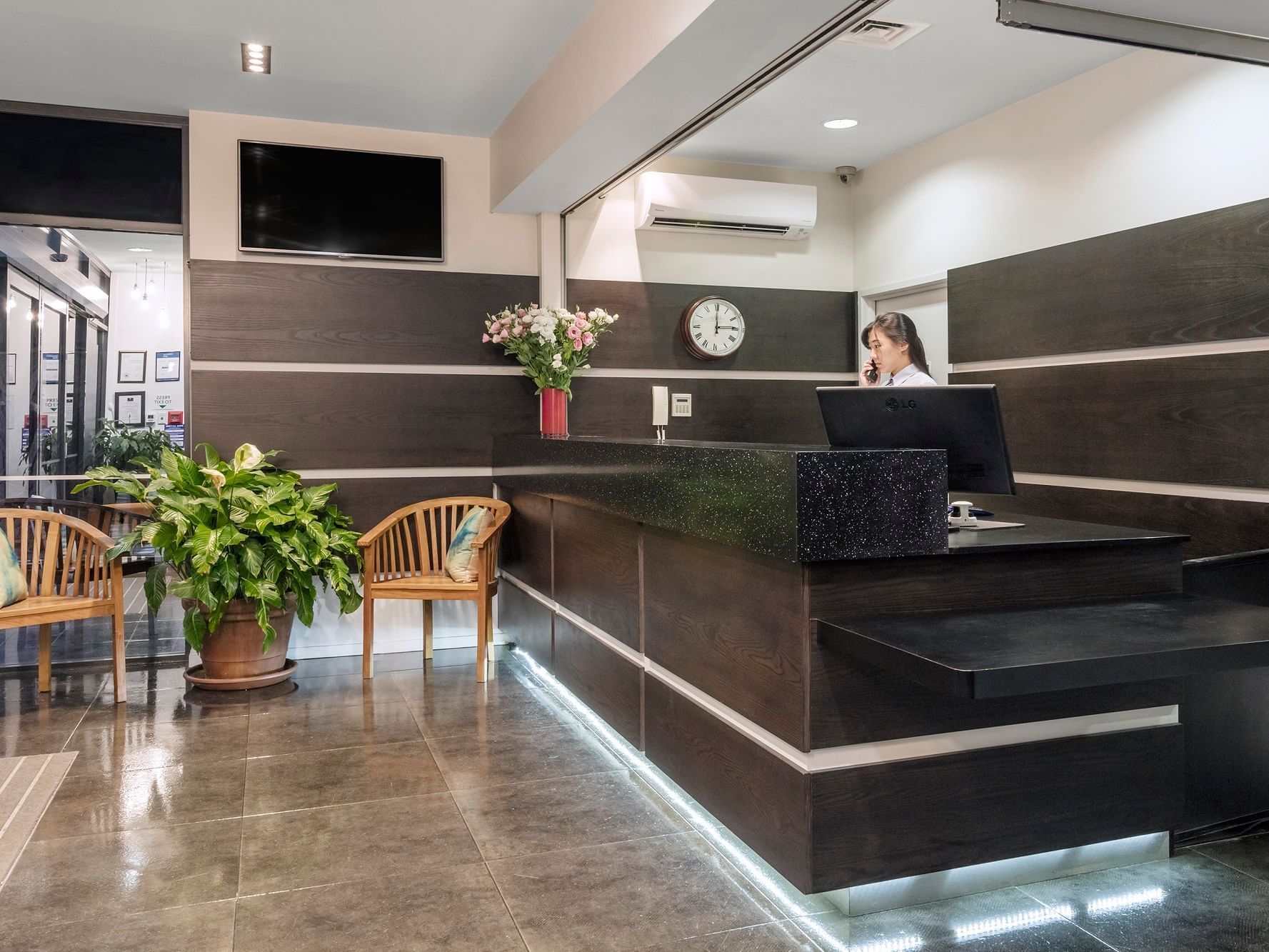 Receptionist by the front desk at Nesuto St Martins