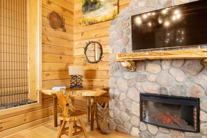 Fireplace & a TV in King Executive Log Cabin at Retro Suites