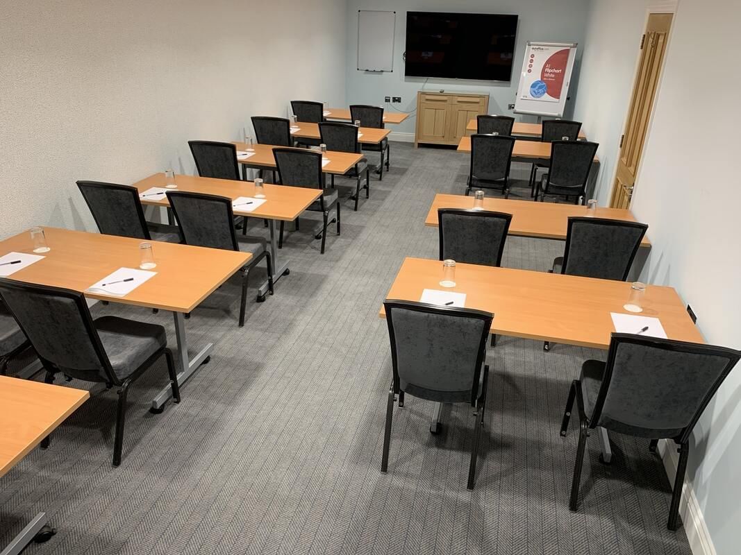 Meeting room arranged in classroom style at Orsett Hall Hotel