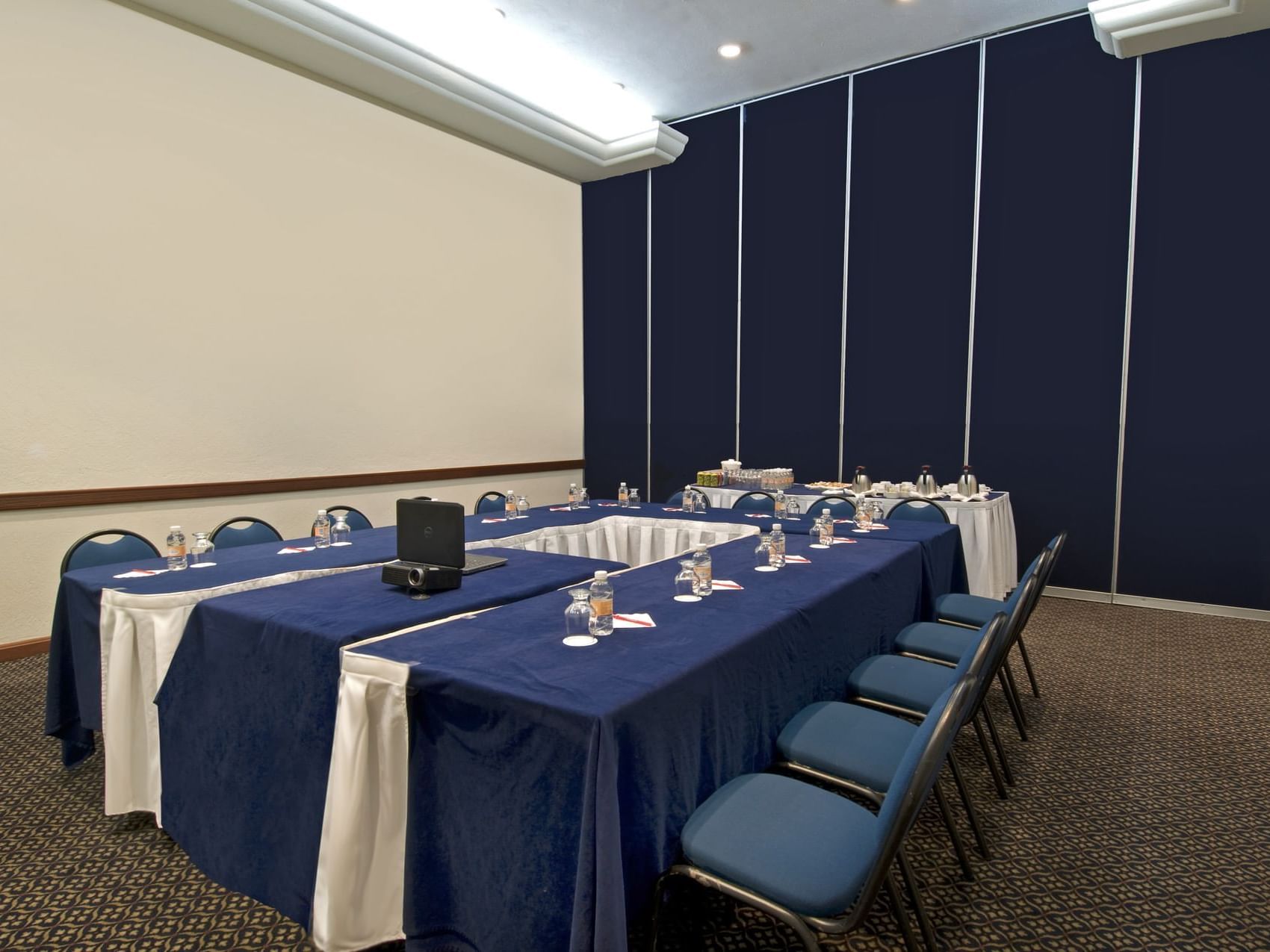 Conference table set up in a meeting room at Fiesta Inn Hotels