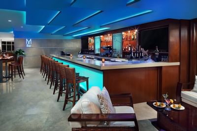 Bar shelves, high chairs in M bar at Marenas Resort Miami