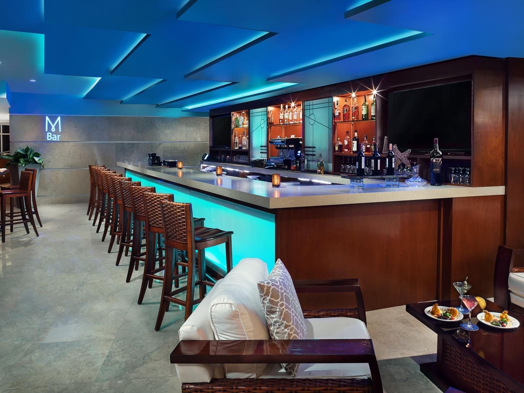 Bar counter with high chairs in M bar at Marenas Resort Miami
