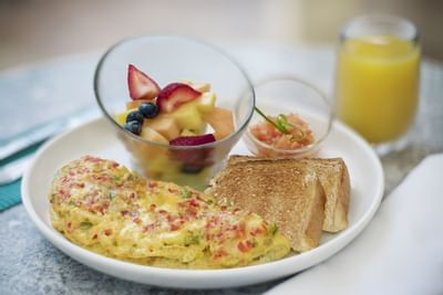 Breakfast served in a restaurant at Windsong Resort On The Reef
