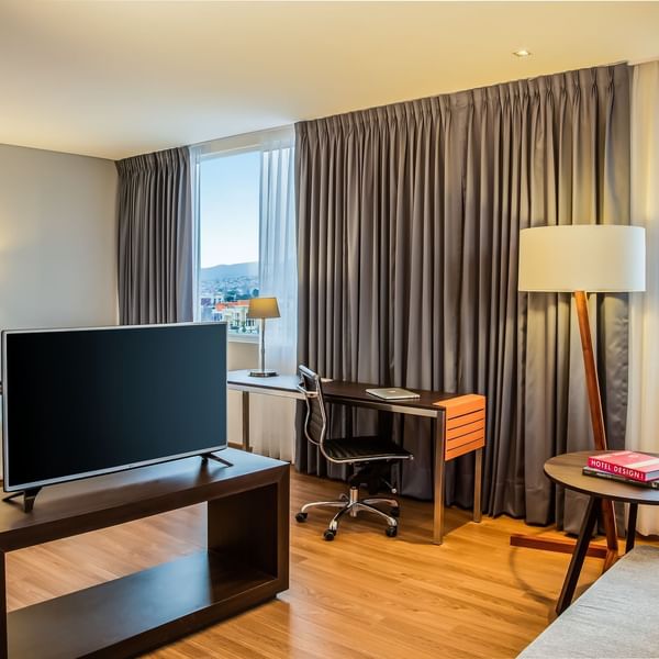 Livingarea with TV & working desk in Junior Suite at Fiesta Inn