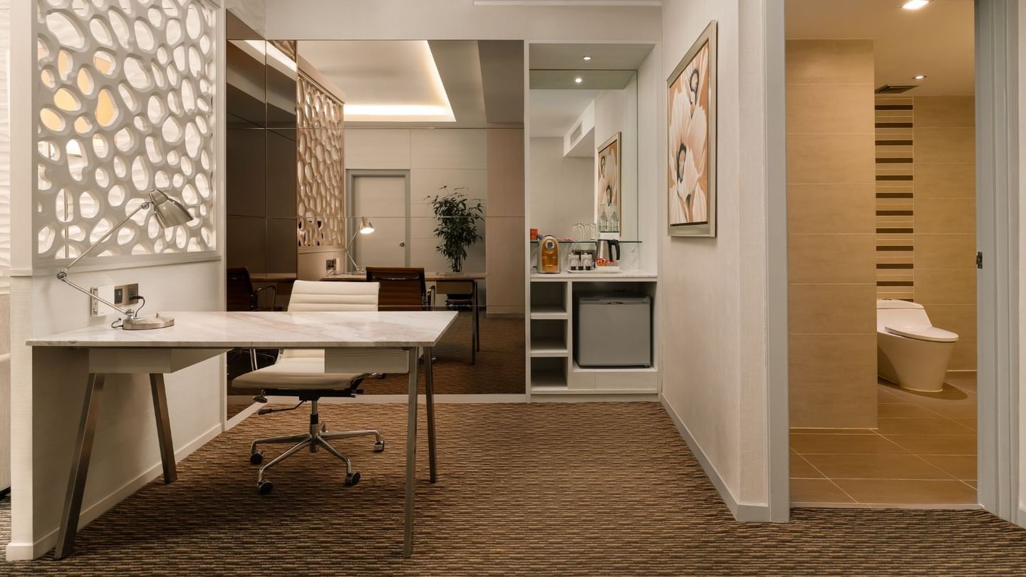 Writing table and guest bathroom in Premier Suite Room