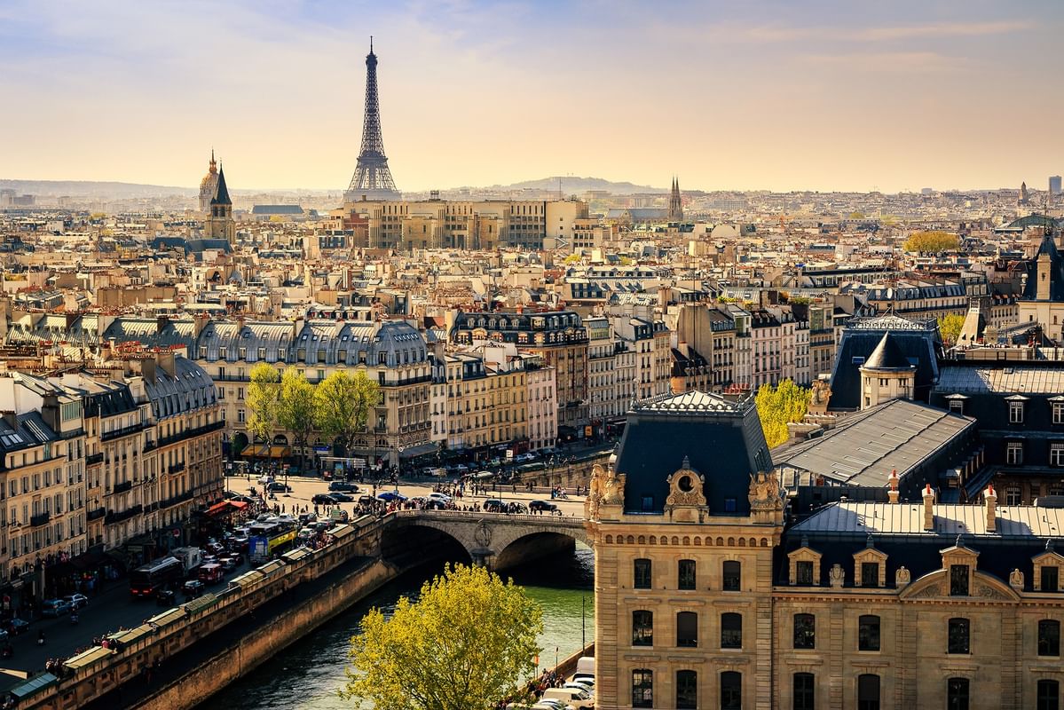 Panoramic city view of Paris skyline featuring the Eiffel Tower by the river near Hotel Westminster Paris