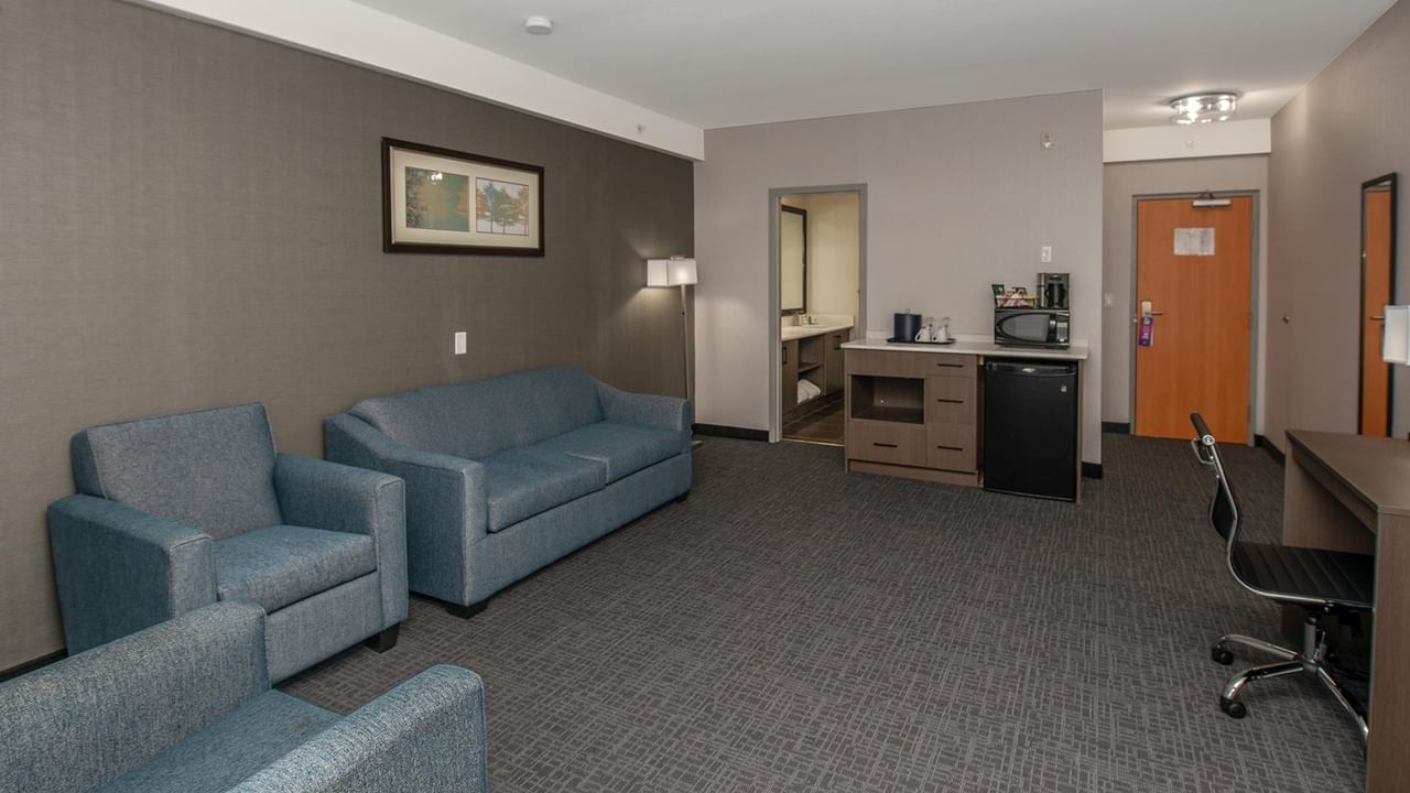 Spacious hotel suite with living area.