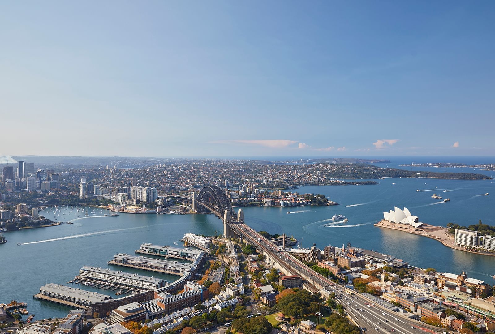 Aerial view of the city and river near Crown Hotels on a sunny day