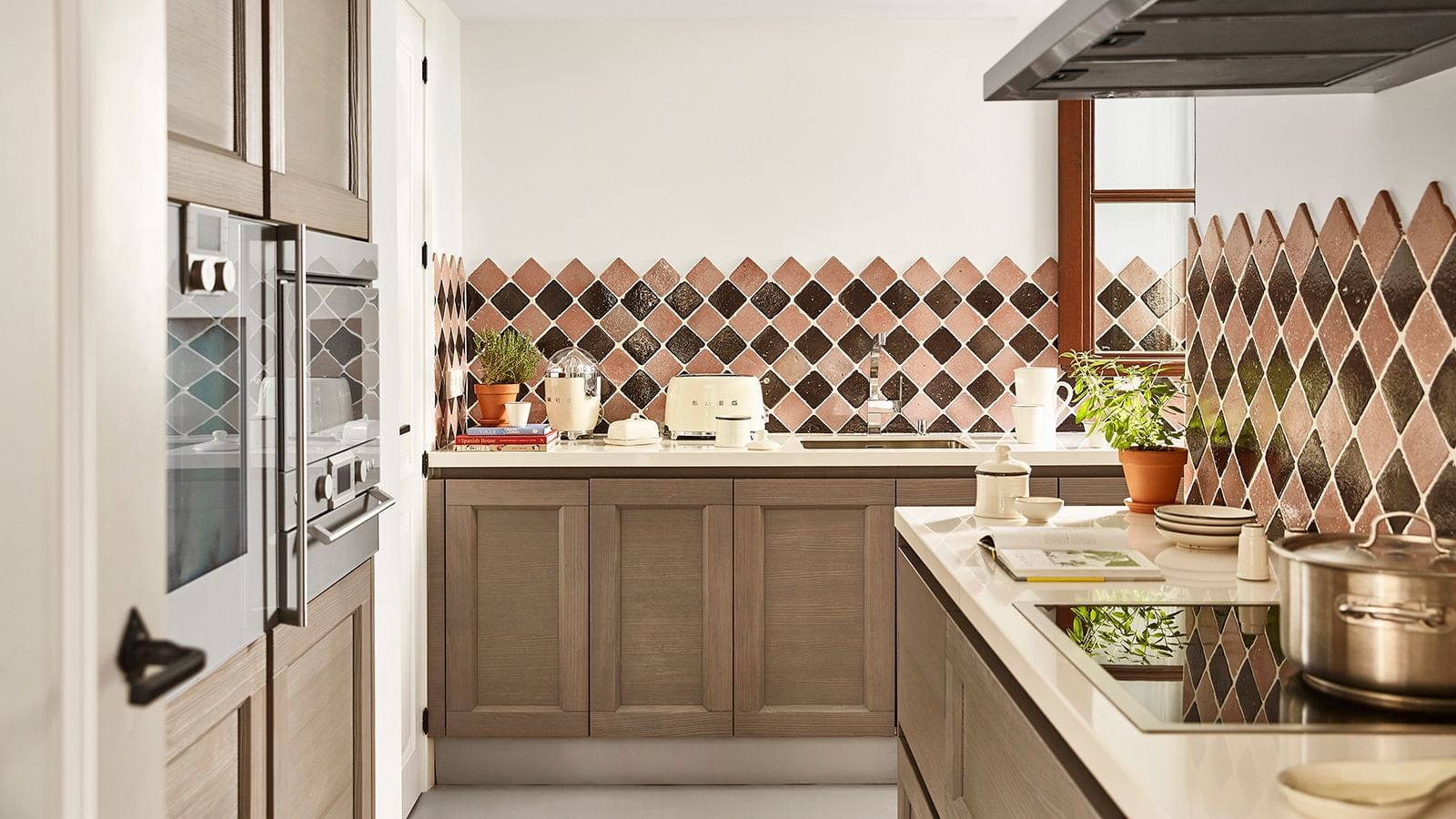 Three-Bedroom Villa interior with brown wood cabinets and diamond-tiled backsplash at Marbella Club