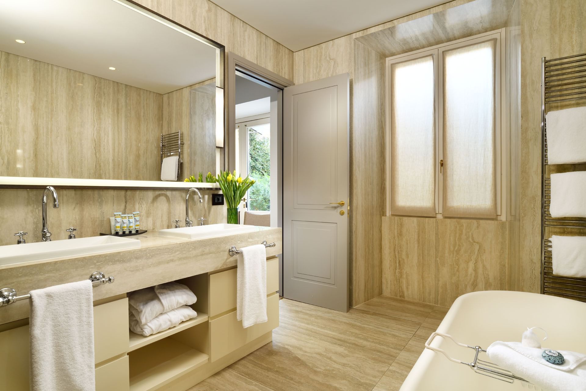 Bathroom interior with amenities & vanity in Garden Suite at Margutta 19