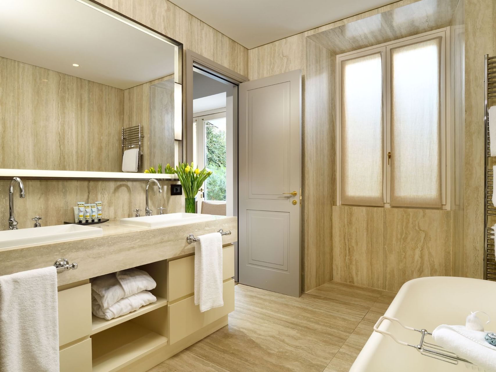Bathroom interior with amenities & vanity in Garden Suite at Margutta 19